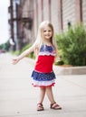 Portrait of smiling little girl walking on street Royalty Free Stock Photo