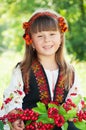 Portrait of a smiling little girl in a wreath, in the national Ukrainian Hutsul costume Royalty Free Stock Photo