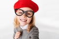 Portrait of a smiling little schoolgirl dressed in uniform Royalty Free Stock Photo