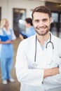 Portrait of smiling male doctor with arms crossed Royalty Free Stock Photo