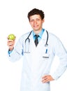 Portrait of a smiling male doctor holding green apple on white Royalty Free Stock Photo