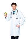 Portrait of a smiling male doctor holding green apple on white Royalty Free Stock Photo