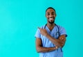 Portrait of a smiling male doctor or nurse pointing with finger  to side Royalty Free Stock Photo