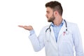 Portrait of a smiling male doctor pointing finger away isolated on a white background Royalty Free Stock Photo