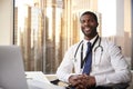 Portrait Of Smiling Male Doctor With Stethoscope In Hospital Office Royalty Free Stock Photo