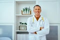 portrait of smiling male doctor with stethoscope looking at camera in hospital Royalty Free Stock Photo