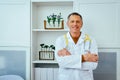 portrait of smiling male doctor with stethoscope looking at camera in hospital Royalty Free Stock Photo