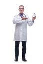 Portrait of a smiling male doctor wearing glasses and holding a bottle of pills Royalty Free Stock Photo