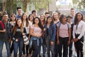 Portrait Of Smiling Male And Female College Students With Teachers Outside School Building Royalty Free Stock Photo