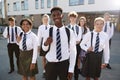 Portrait Of Smiling Male And Female High School Students Wearing Uniform Outside College Building Royalty Free Stock Photo