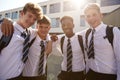 Portrait Of Smiling Male High School Students Wearing Uniform Outside College Building Royalty Free Stock Photo