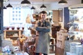 Portrait Of Smiling Male Owner Of Delicatessen Shop Wearing Apron Royalty Free Stock Photo