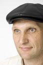 Portrait of the smiling man in a cap Royalty Free Stock Photo