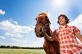 Portrait of smiling man with his beautiful horse Royalty Free Stock Photo