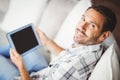 Portrait of smiling man holding digital tablet Royalty Free Stock Photo