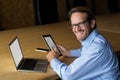 Portrait of smiling man holding digital tablet in office Royalty Free Stock Photo