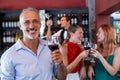 Portrait of smiling man holding glass of red wine Royalty Free Stock Photo