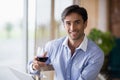 Portrait of smiling man holding glass of red wine Royalty Free Stock Photo