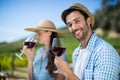 Portrait of smiling man holding red wine Royalty Free Stock Photo