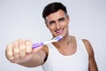 Portrait of a smiling man holding toothbrush Royalty Free Stock Photo