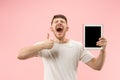 Portrait of smiling man pointing at laptop with blank screen isolated on white Royalty Free Stock Photo