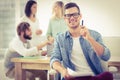 Portrait of smiling man showing pen at office Royalty Free Stock Photo