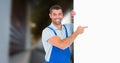 Portrait of smiling manual worker pointing at blank billboard Royalty Free Stock Photo