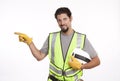 Portrait of a smiling manual worker pointing sideways Royalty Free Stock Photo