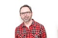 Portrait of a smiling mature man with beard wearing red plaid shirt and glasses Royalty Free Stock Photo