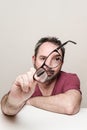 Portrait of a smiling mature man with beard wearing red t-shirt and glasses Royalty Free Stock Photo