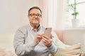 Portrait of smiling mature man using mobile phone Royalty Free Stock Photo