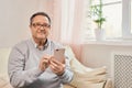 Portrait of smiling mature man using mobile phone Royalty Free Stock Photo