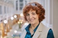 Portrait of a smiling mature woman of European appearance inside a shopping mall Royalty Free Stock Photo