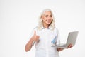 Portrait of a smiling mature woman holding laptop computer Royalty Free Stock Photo