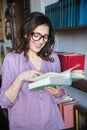 Portrait of a smiling mature woman reading book Royalty Free Stock Photo