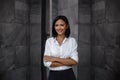 Portrait of a Smiling Mixed Races Business Woman, Crossed Arm