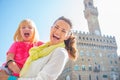 Portrait of smiling mother and baby girl in florence, italy Royalty Free Stock Photo