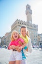 Portrait of smiling mother and baby girl in florence, italy Royalty Free Stock Photo