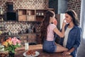 Mother and daughter touching noses with fingers Royalty Free Stock Photo