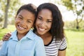 Portrait Of Smiling Mother With Son Relaxing In Park Royalty Free Stock Photo