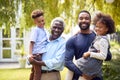 Portrait Of Smiling Multi-Generation Family At Home In Garden Together Royalty Free Stock Photo