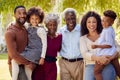Portrait Of Smiling Multi-Generation Family At Home In Garden Together Royalty Free Stock Photo