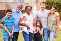 Portrait Of Smiling Multi-Generation Mixed Race Family In Garden At Home Royalty Free Stock Photo