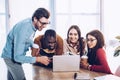 portrait of smiling multicultural business people working on laptop together Royalty Free Stock Photo