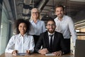 Portrait of smiling multiethnic businesspeople posing in office Royalty Free Stock Photo