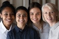 Portrait of smiling multiethnic colleagues show unity