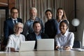 Portrait of smiling multiethnic employees working on computers Royalty Free Stock Photo