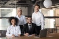 Portrait of smiling multiracial colleagues posing for picture in office Royalty Free Stock Photo