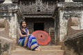 Myanmar woman in Burmese traditional dress at Shwenandaw Kyang monastery in Mandalay Myanmar