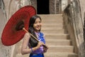 Myanmar woman in Burmese traditional dress at Shwenandaw Kyang monastery in Mandalay Myanmar